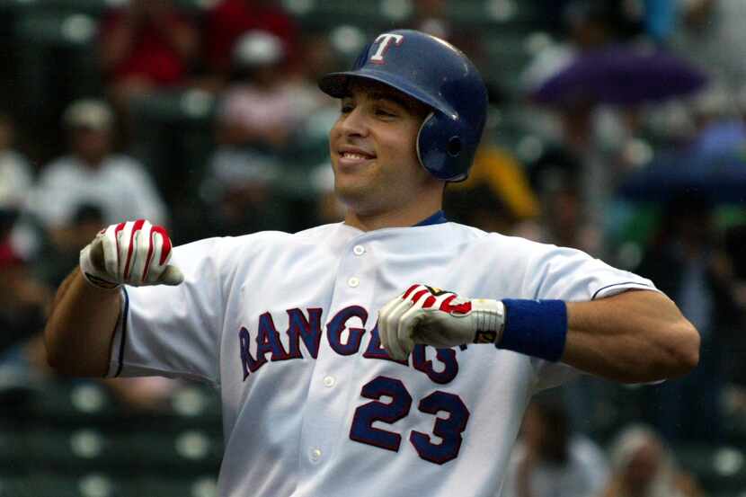 Texas'  Mark Teixeira is all smiles afteer his second homer of the game against Kansas City...