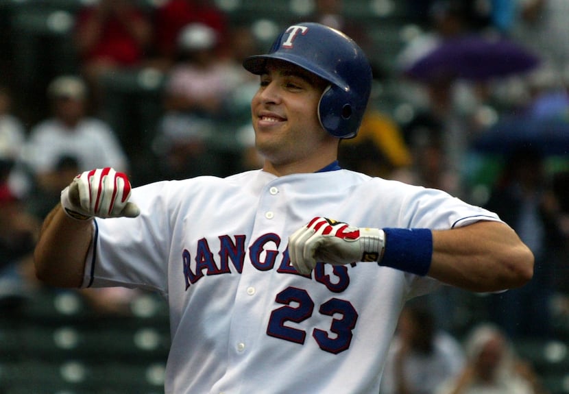 Texas'  Mark Teixeira is all smiles afteer his second homer of the game against Kansas City...