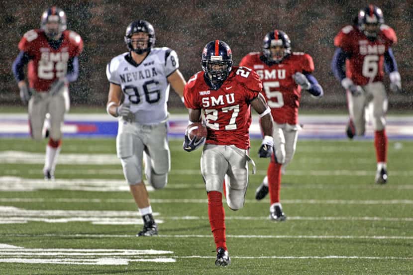  November 13, 2004 -- SMU defensive back Alvin Nnabuife (27) ties a school record with a...