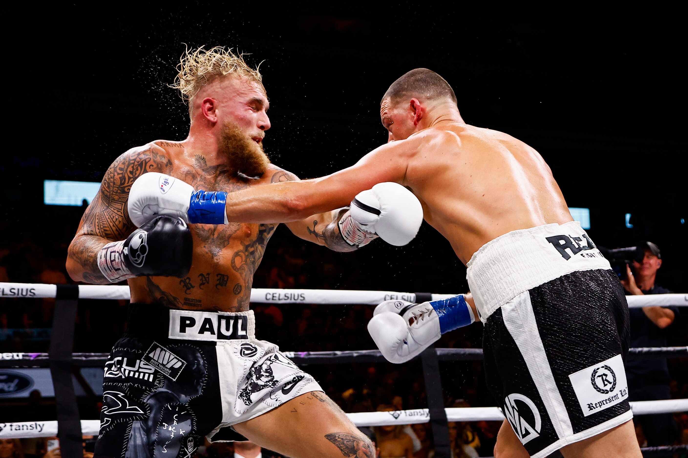 Nate Diaz, right, lands a punch on Jake Paul during a boxing match in Dallas, Saturday,...