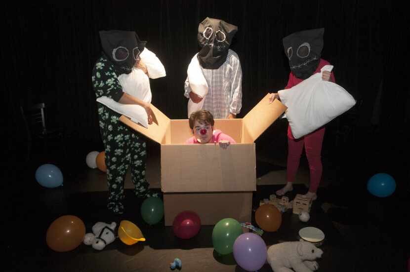 Jeff Colangelo, in box, and the characters known as the Pillomen, perform a scene from...