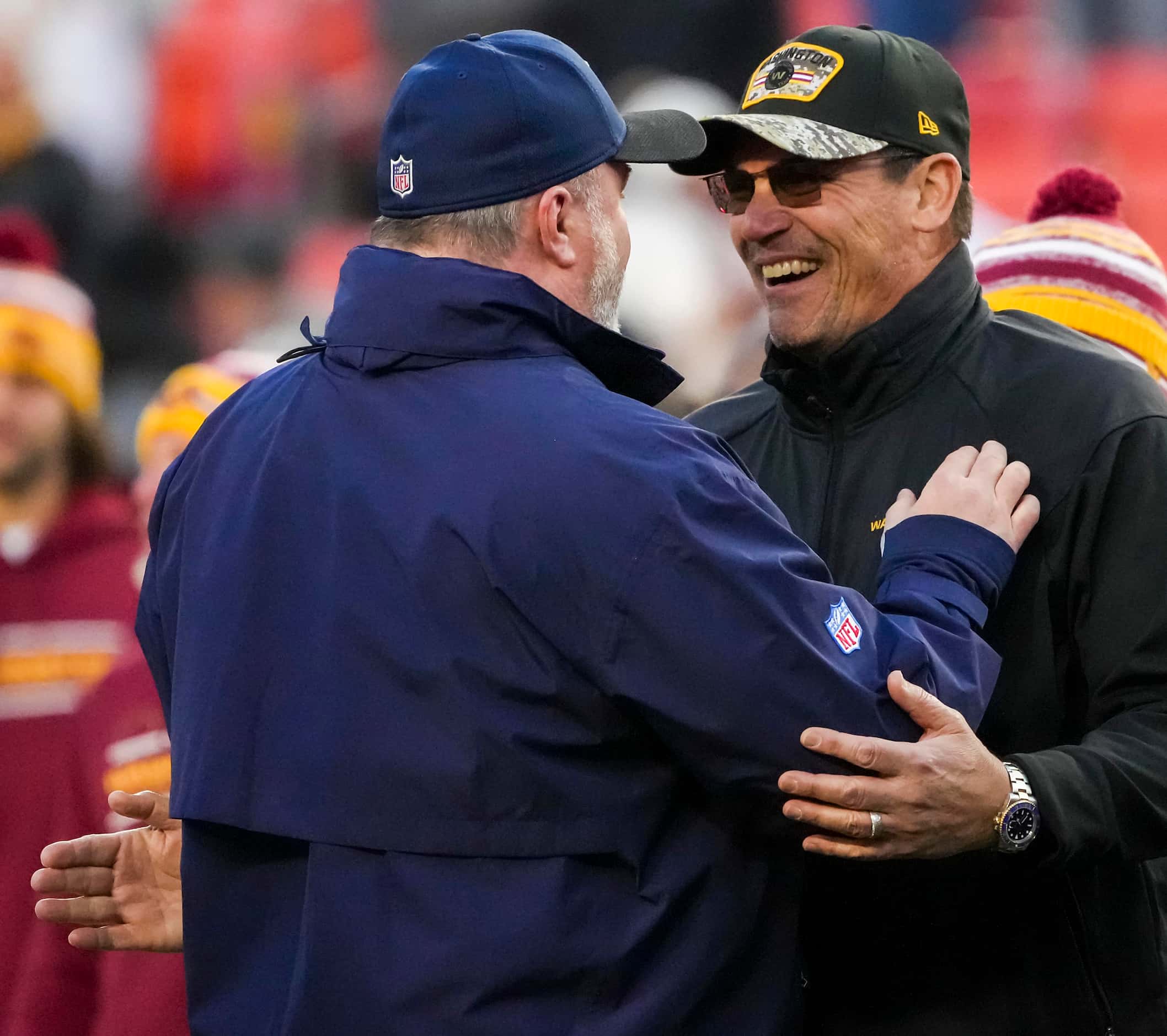 Washington Football Team head coach Ron Rivera laughs with Dallas Cowboys head coach Mike...