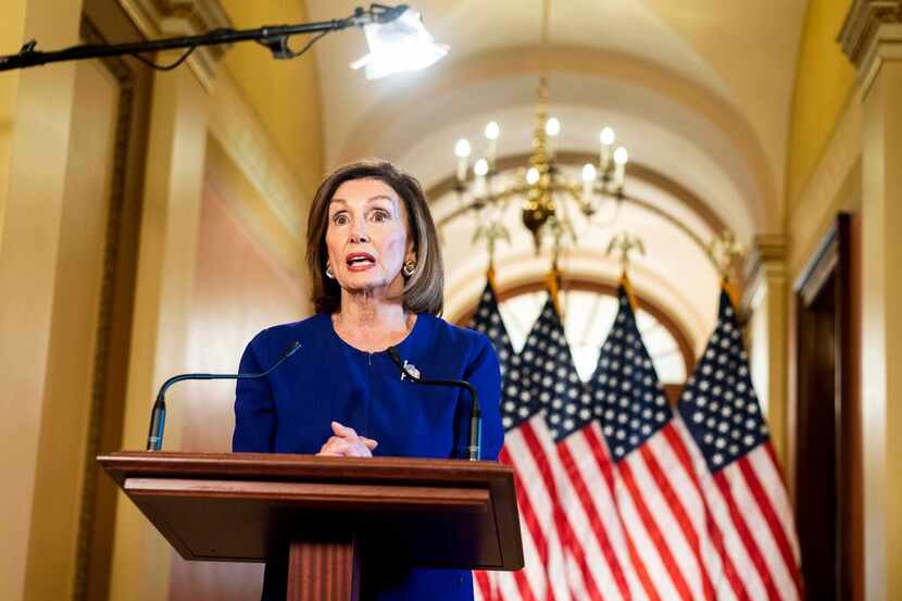From the Speaker's Balcony hallway, Speaker of the House Nancy Pelosi, D-Calif., delivers a...