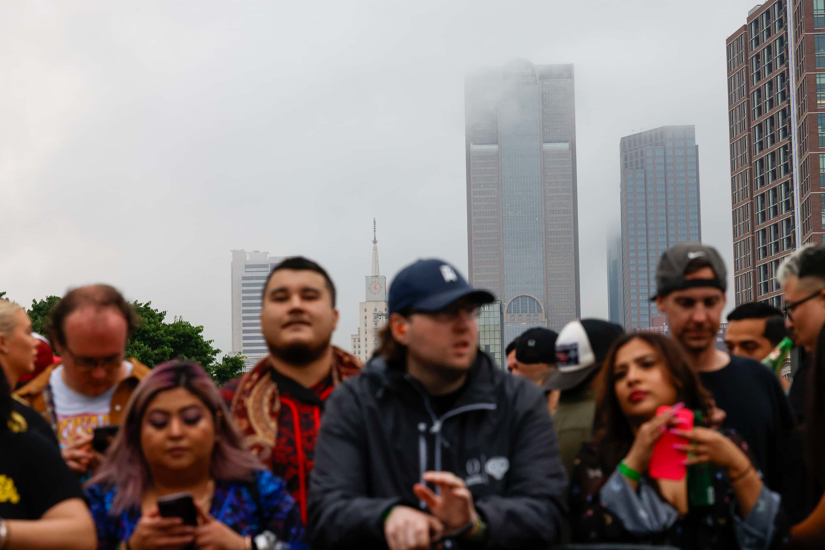 Clouds covers part of Dallas skyline as crowd gather  before a surprise pop up show with DJ...