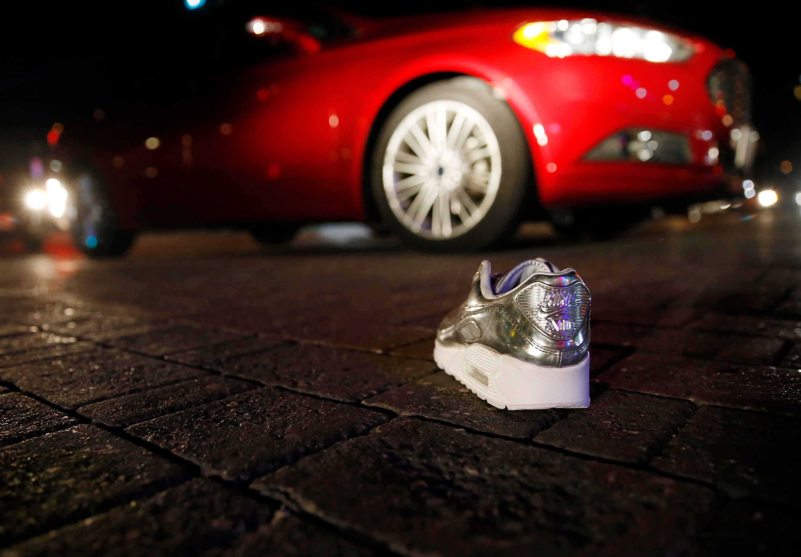 A lone shoe from one of the stores sits in the middle of Main Street in Deep Ellum in...