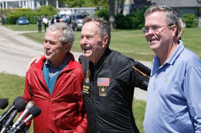 
George W. Bush stood with his father, George H.W. Bush, and brother Jeb Bush after the...