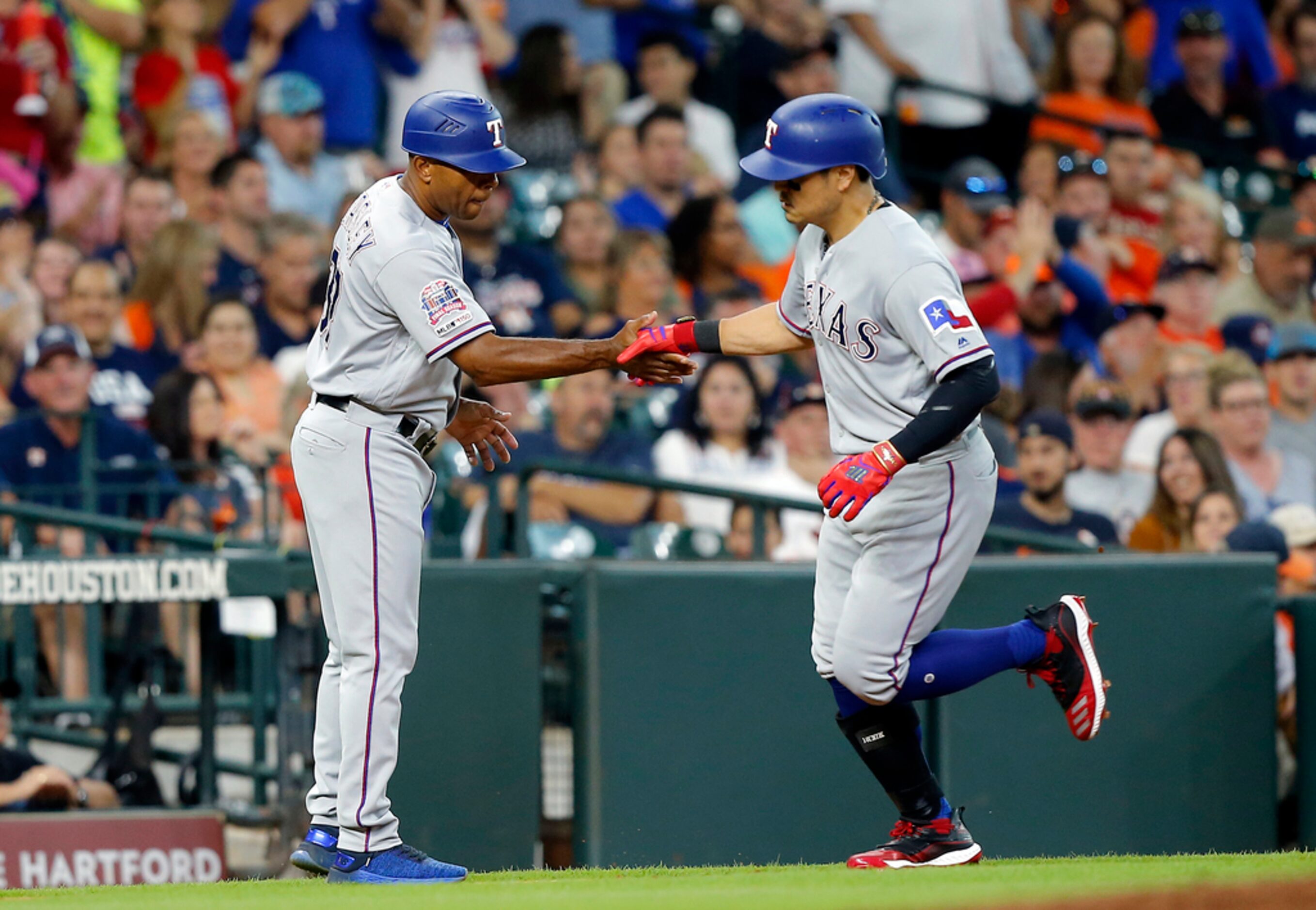 HOUSTON, TEXAS - JULY 20: Shin-Soo Choo #17 of the Texas Rangers receives congratulations...