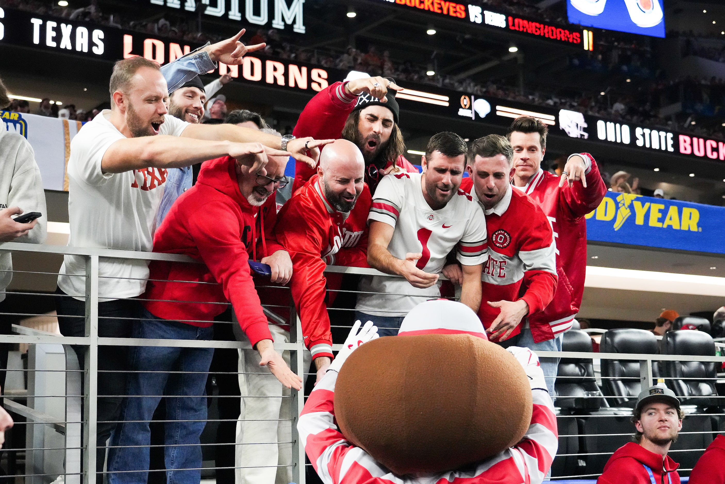 Ohio State fans cheer with mascot Brutus during the first half of the Cotton Bowl NCAA...