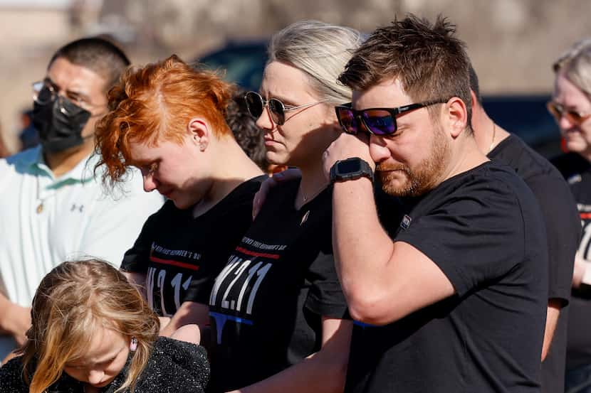 Adam Gerred, brother of Tiffany Gerred, wipes away tears alongside his wife Kristen Gerred...