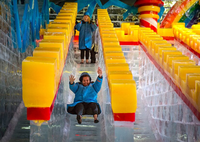 Carla Lule tries out a slide at ICE!, the annual exhibit at the Gaylord Texan Resort Hotel ...