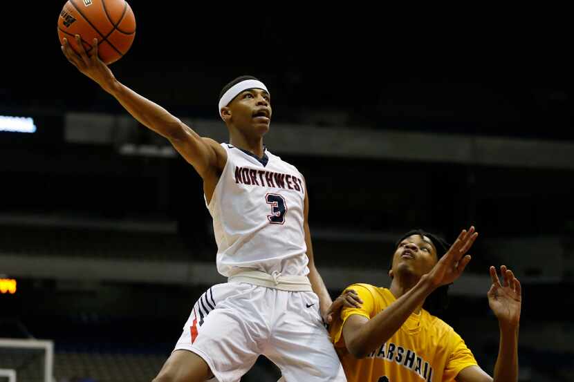 Justin Northwest's Avery Anderson (3) scores past Fort Bend Marshall's John Walker III (24)...