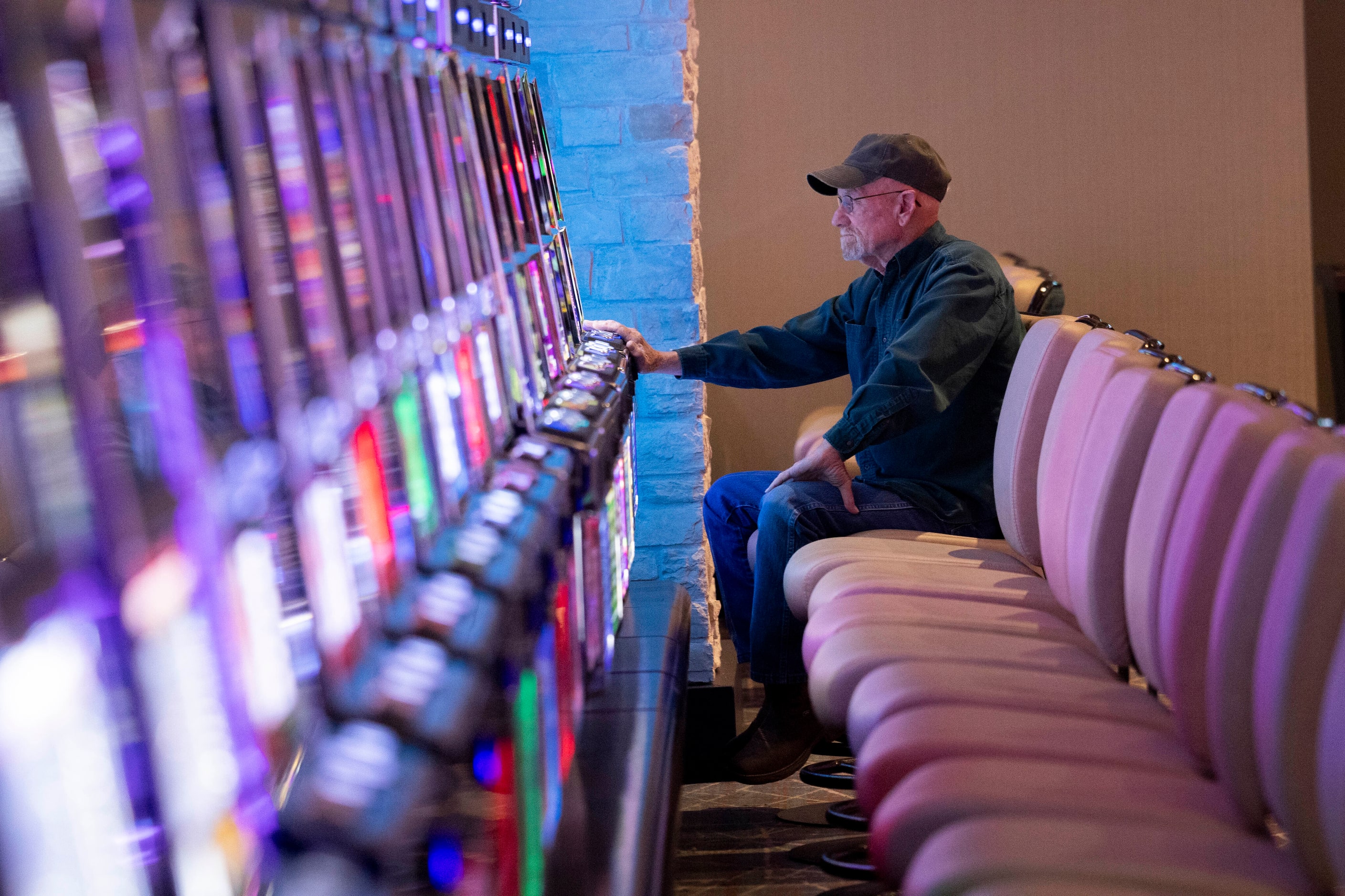 Reggie Webb of Arkansas plays a slot machine at Choctaw Landing on Wednesday, April 24,...