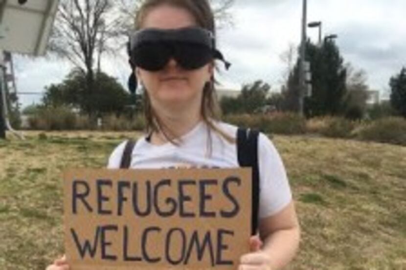  Heidi Hickman stages a counterprotest against the anti-refugee group. (Sarah Mervosh/Staff)