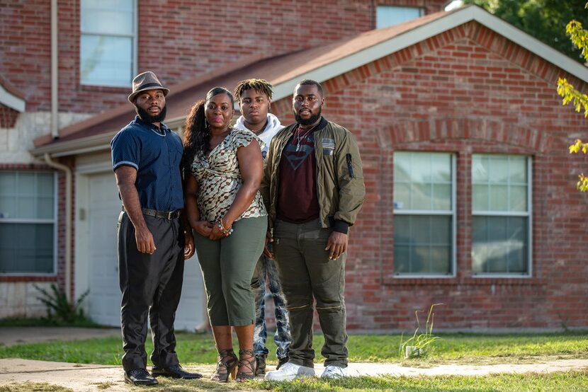 Sammie Anderson, second from left, poses with her sons (from left to right) Samuel Bible,...