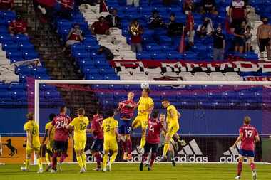 Socially distant FC Dallas supporters as FC Dallas forward Zdenek Ondrasek (13) fights for...