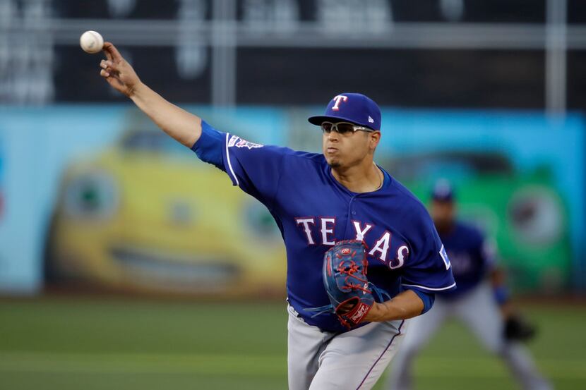 Texas Rangers pitcher Ariel Jurado works against the Oakland Athletics in the first inning...