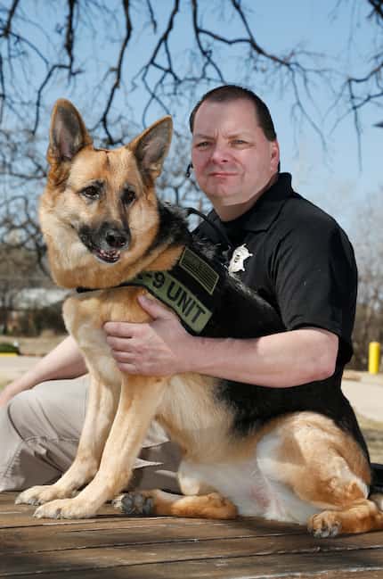 Jim Osorio, of Canine Encounters Law Enforcement Training, with his German Shepherd, Coral,...