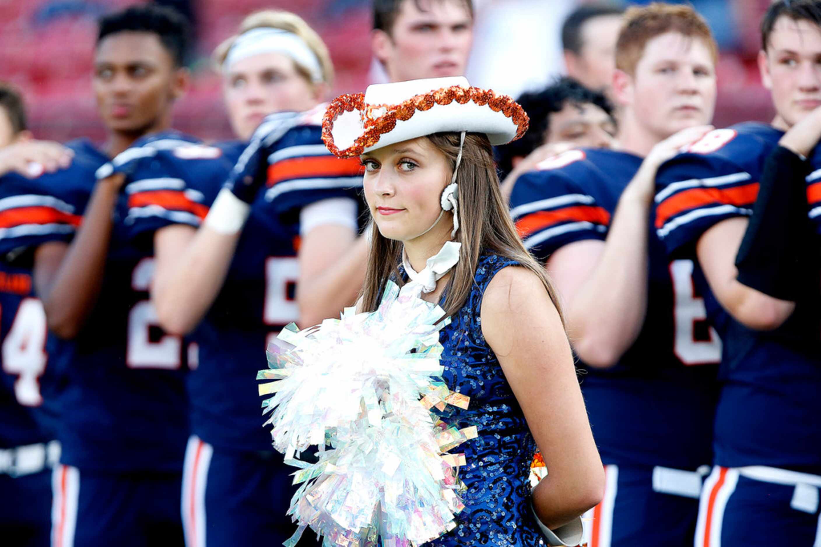Olivia Graney with the Wakeland High School Legacy Line, stands at attention during the...