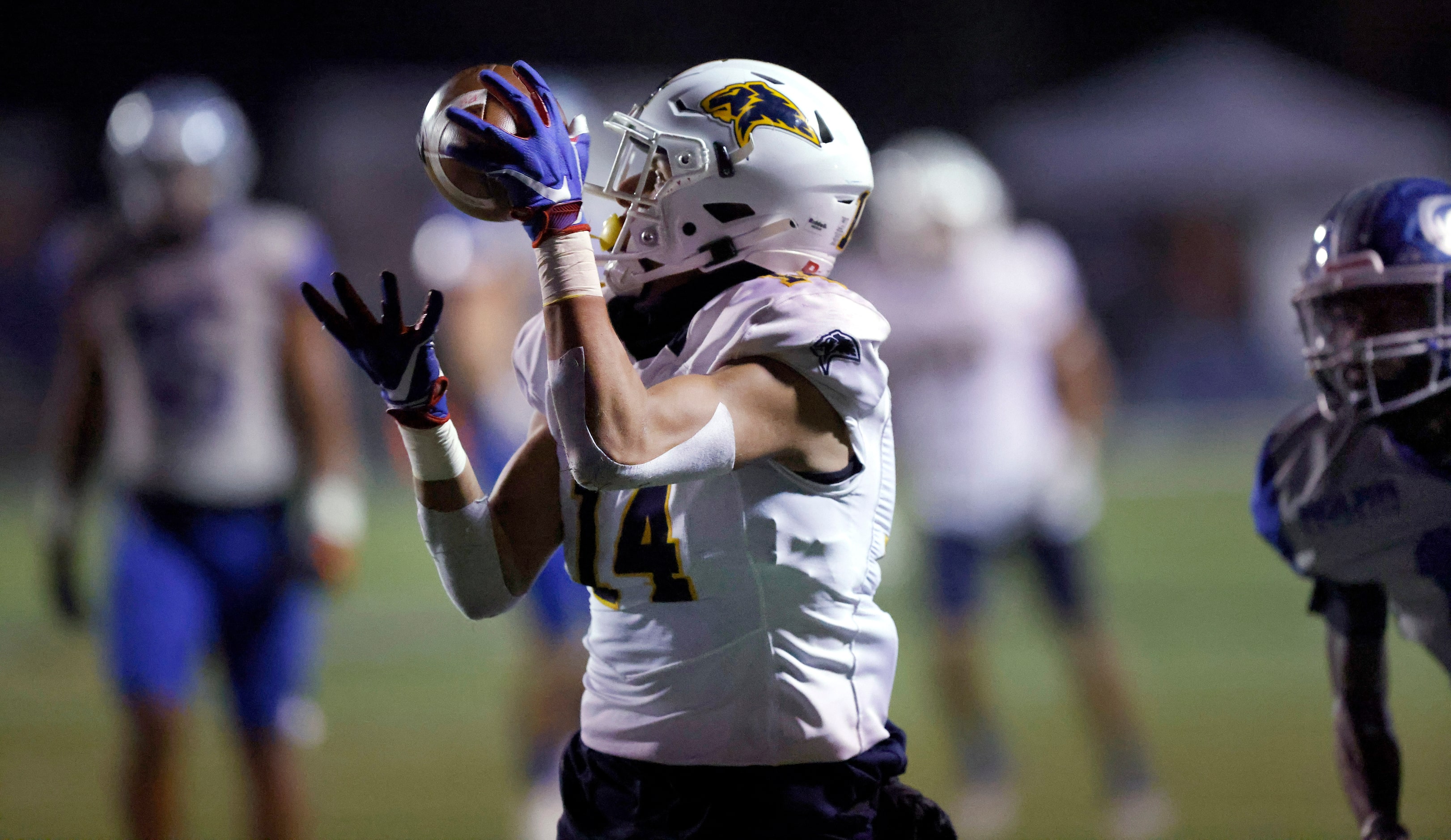 Plano Prestonwood Christian Academy receiver Coco Escheik (14) hauls in a second quarter...