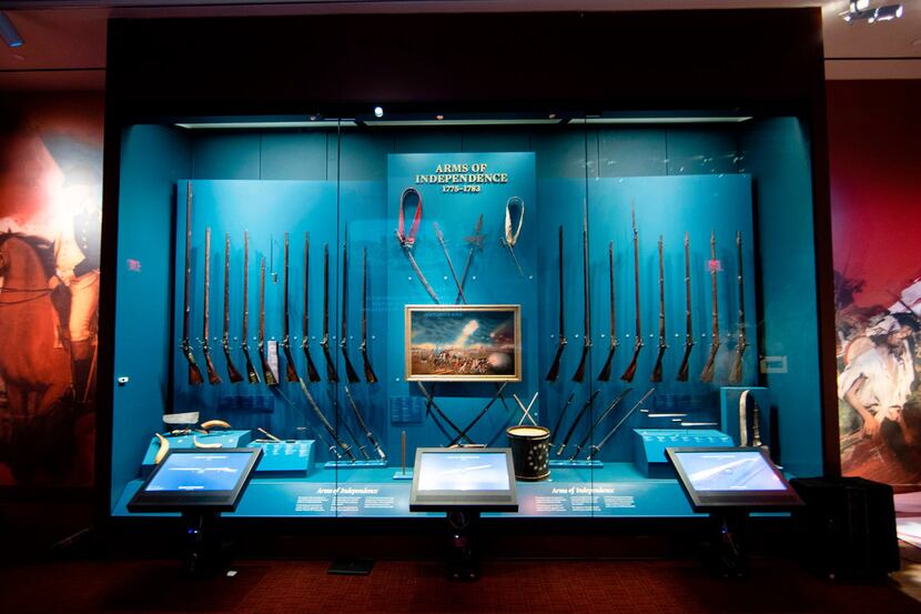 A display of weapons used during the Revolutionary War, including a fife and drum, at the...