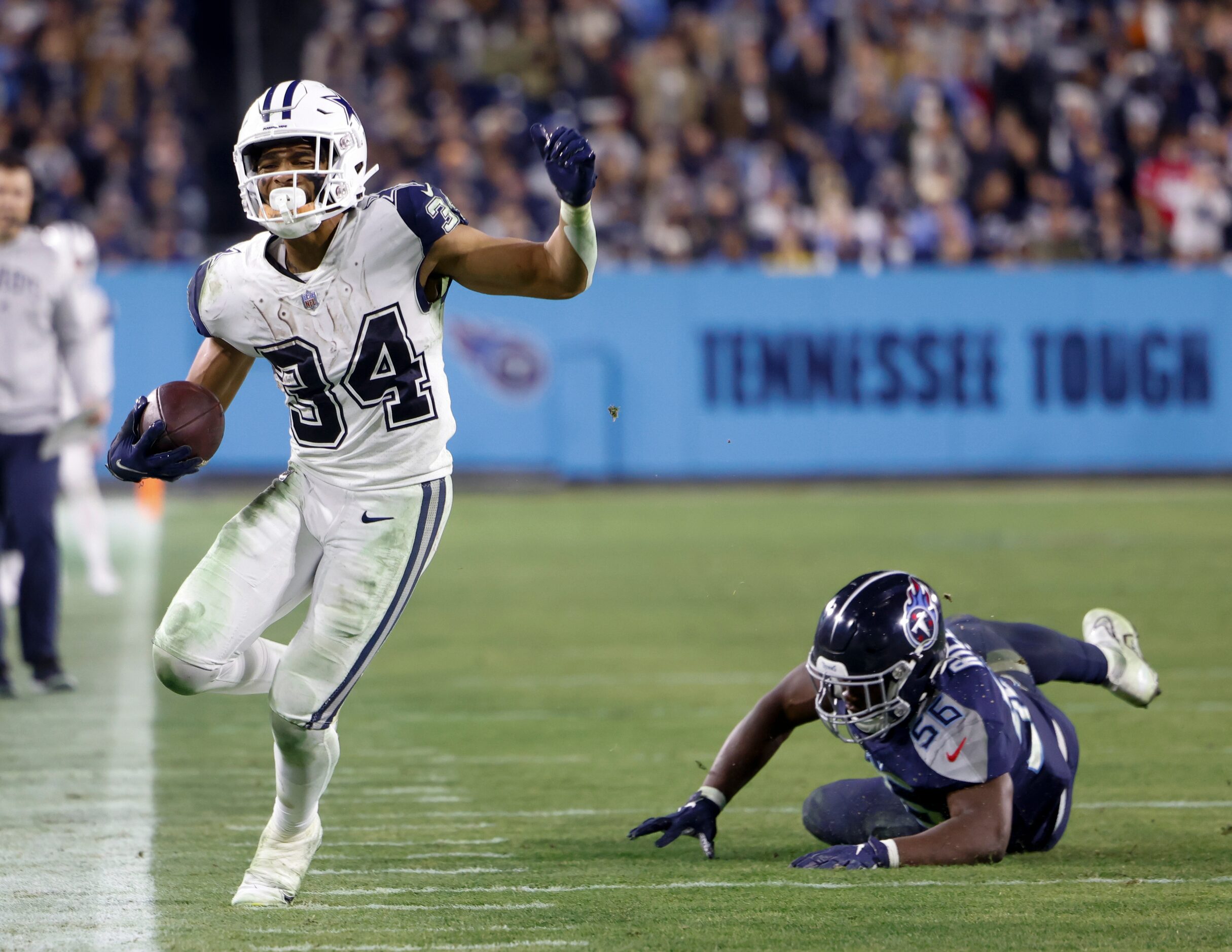 Tennessee Titans linebacker Monty Rice (56) forces Dallas Cowboys running back Malik Davis...