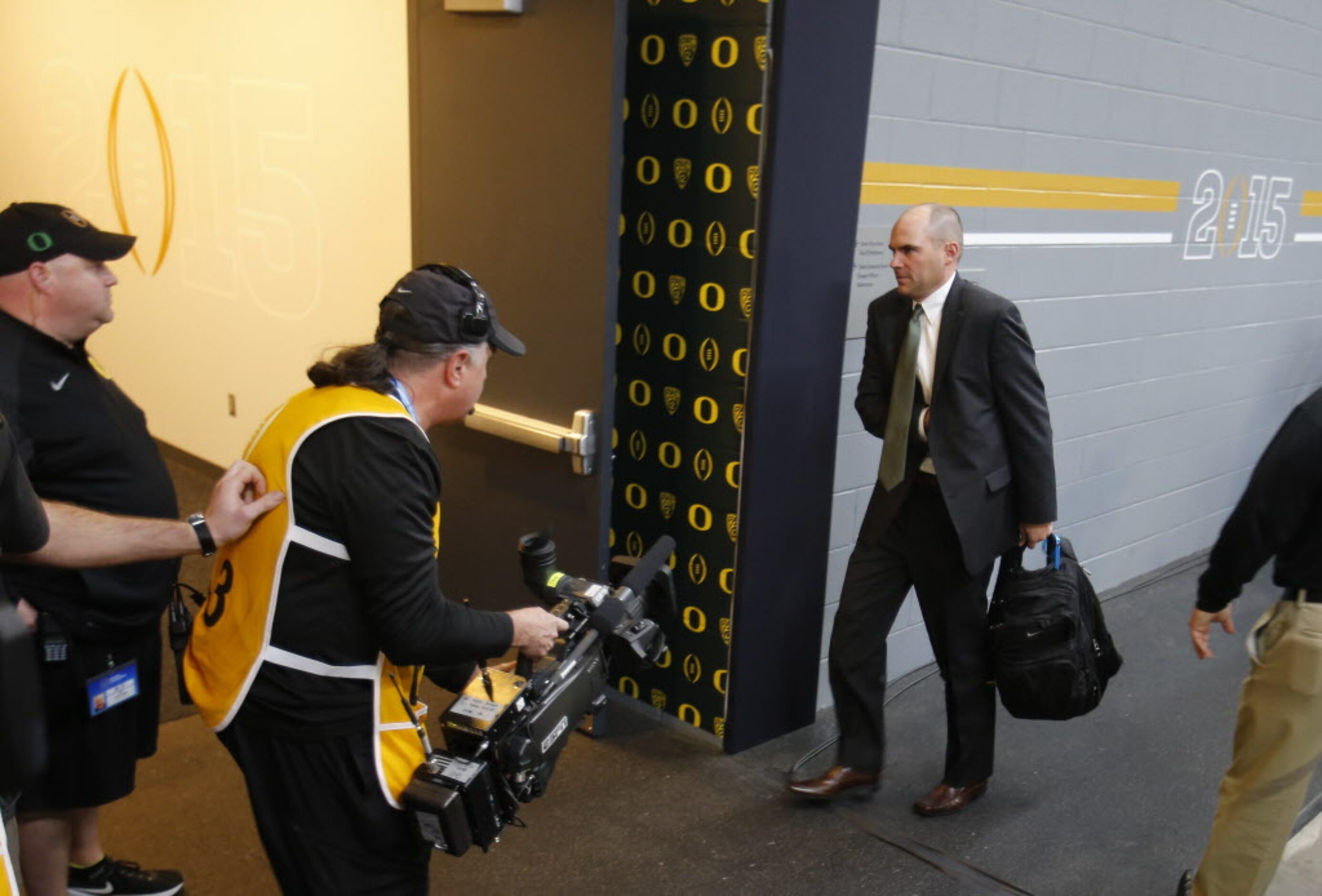 Oregon Ducks head coach Mark Helfrich makes his way towards the locker room before a game...