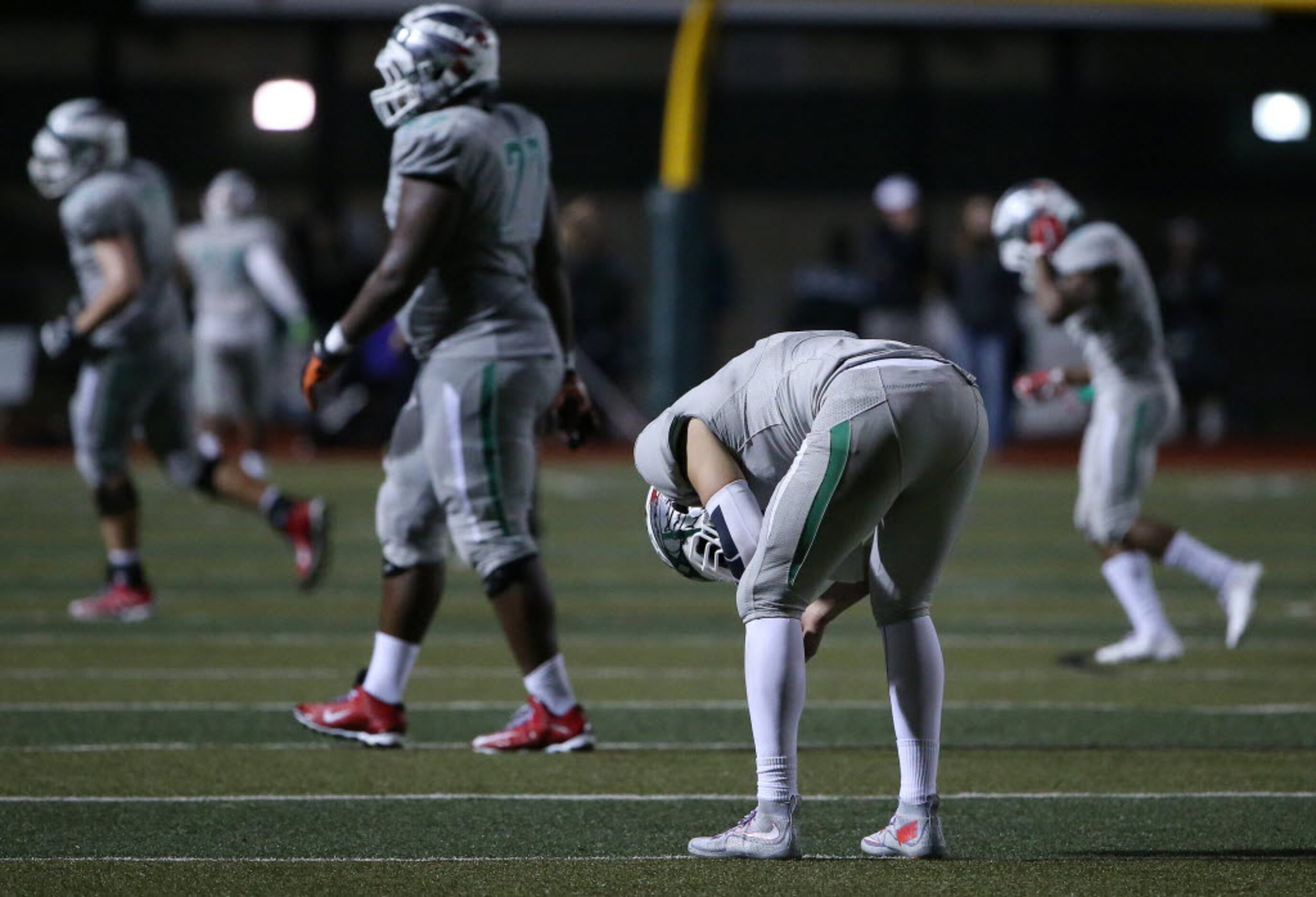 Waxahachie quarterback Jordan Kitna (3) reacts after throwing an interception that was...