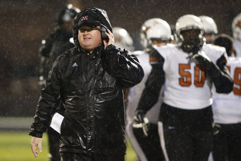 TXHSFB West Mesquite head coach Jeff Neill walks along the sideline in the first half of...