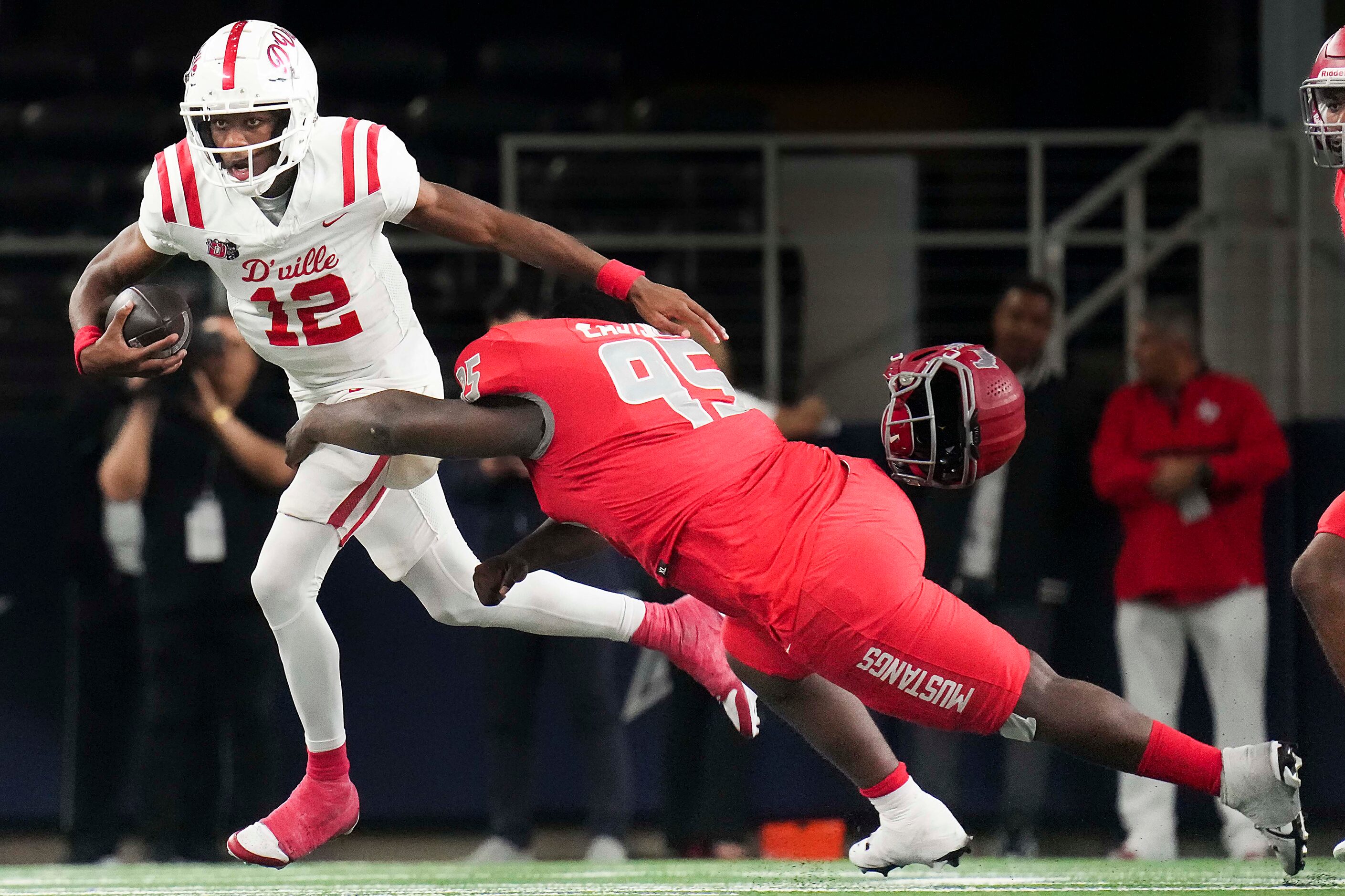 Duncanville quarterback Keelon Russell (12) pushes past Galena Park North Shore defensive...