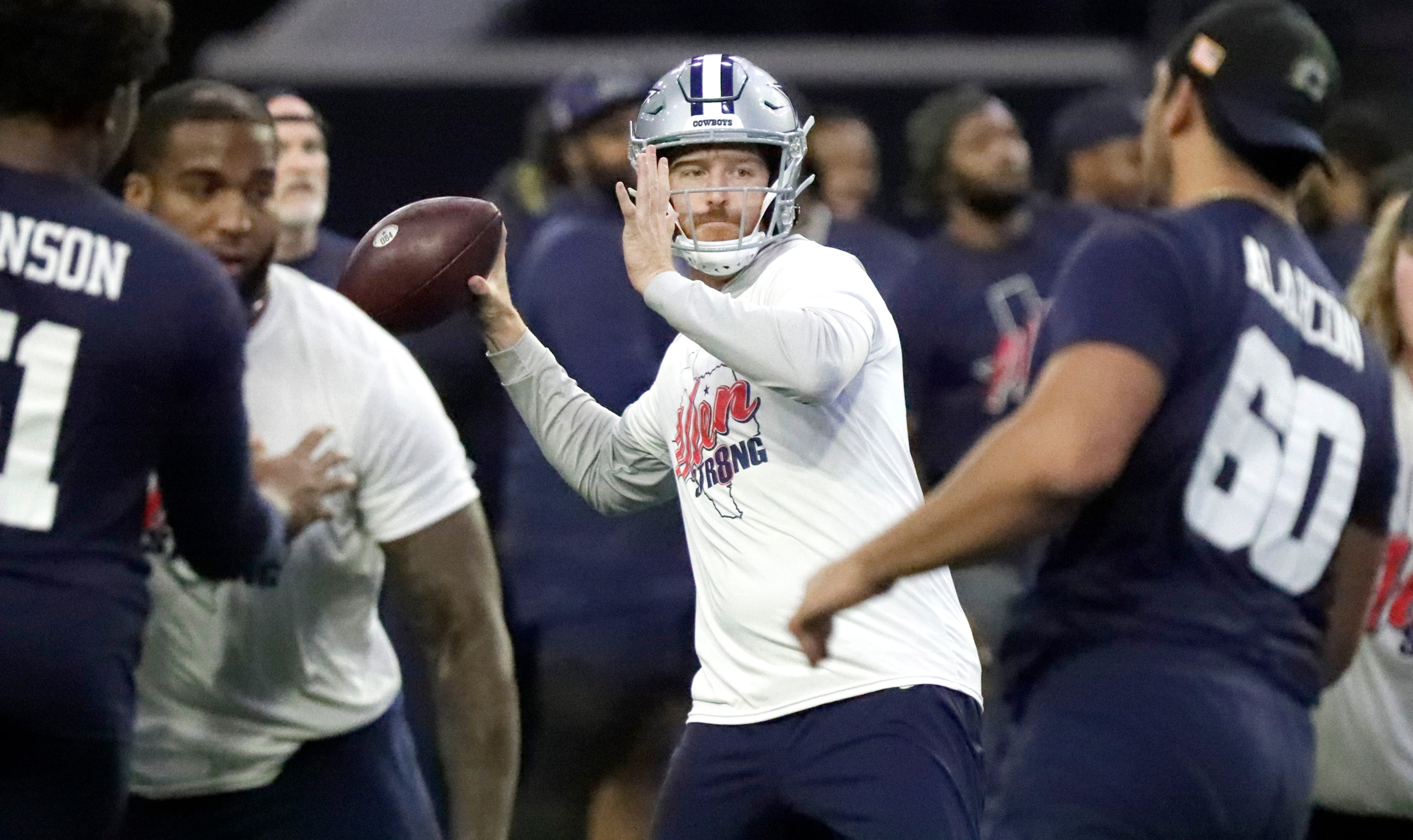 Quarterback Cooper Rush throws the football on a pass play as the Dallas Cowboys held mini...