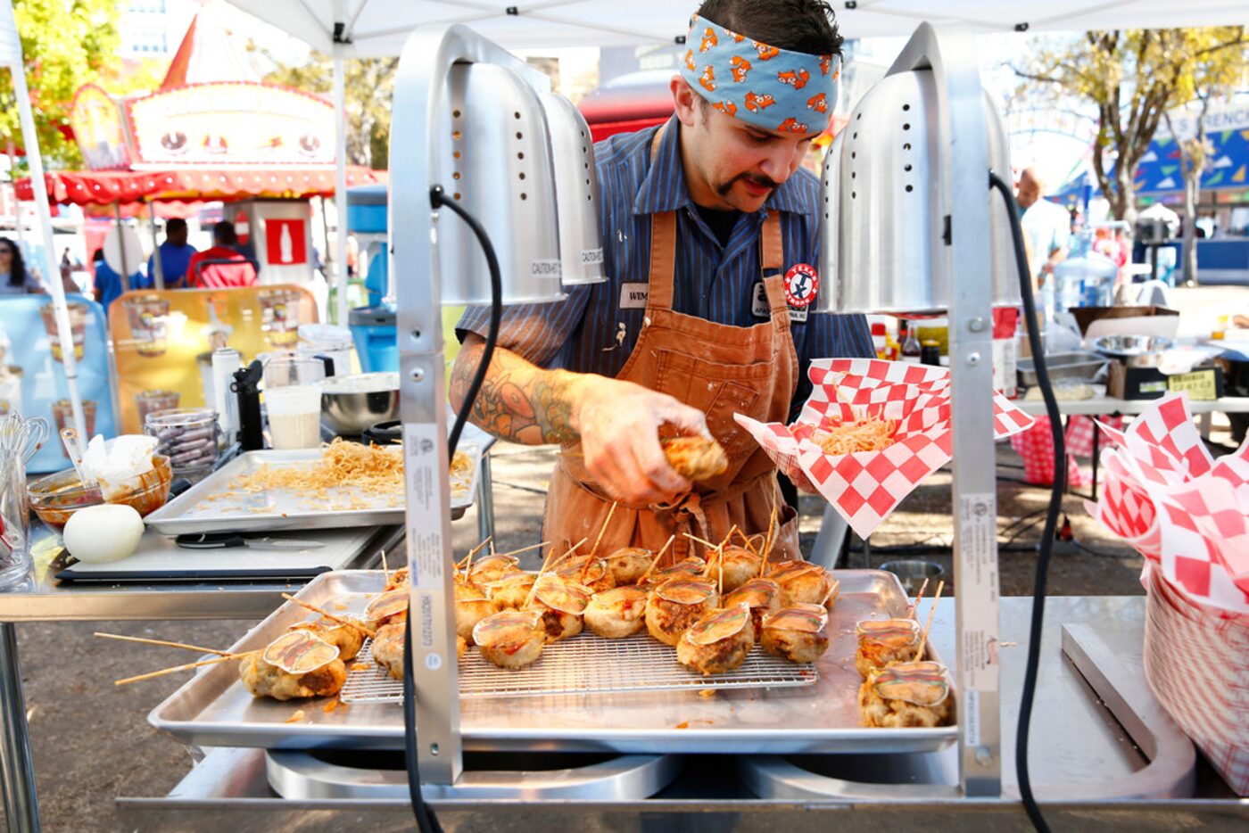 Richie Farina prepares his burgers as Food Network films a television pilot at the State...