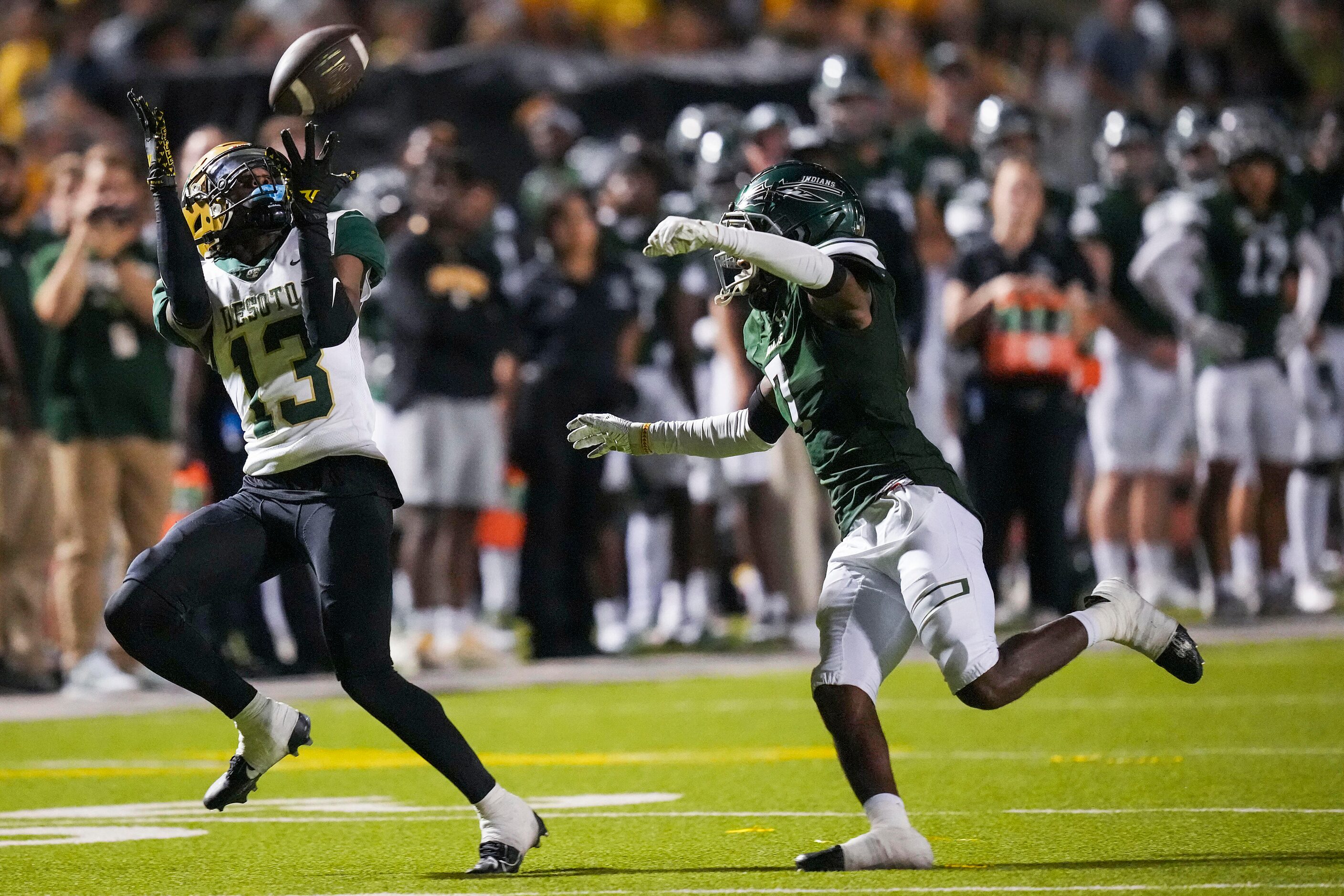 DeSoto  wide receiver Daylon Singleton (13) catches a 36-yard  pass as Waxahachie defensive...