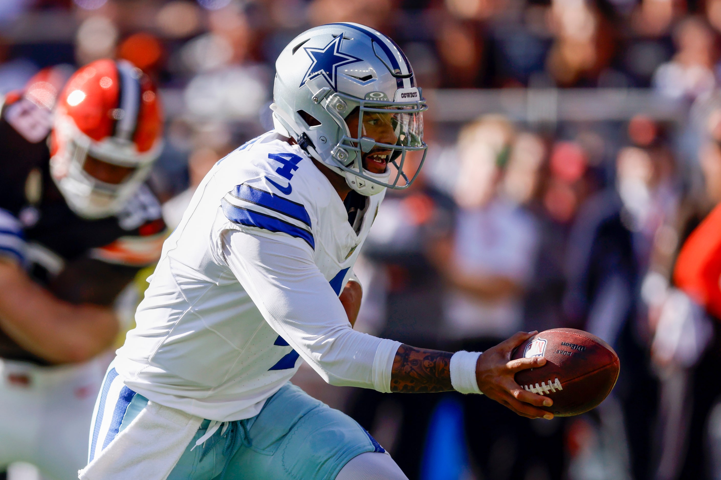 Dallas Cowboys quarterback Dak Prescott (4) drops back to hand the ball off during the first...