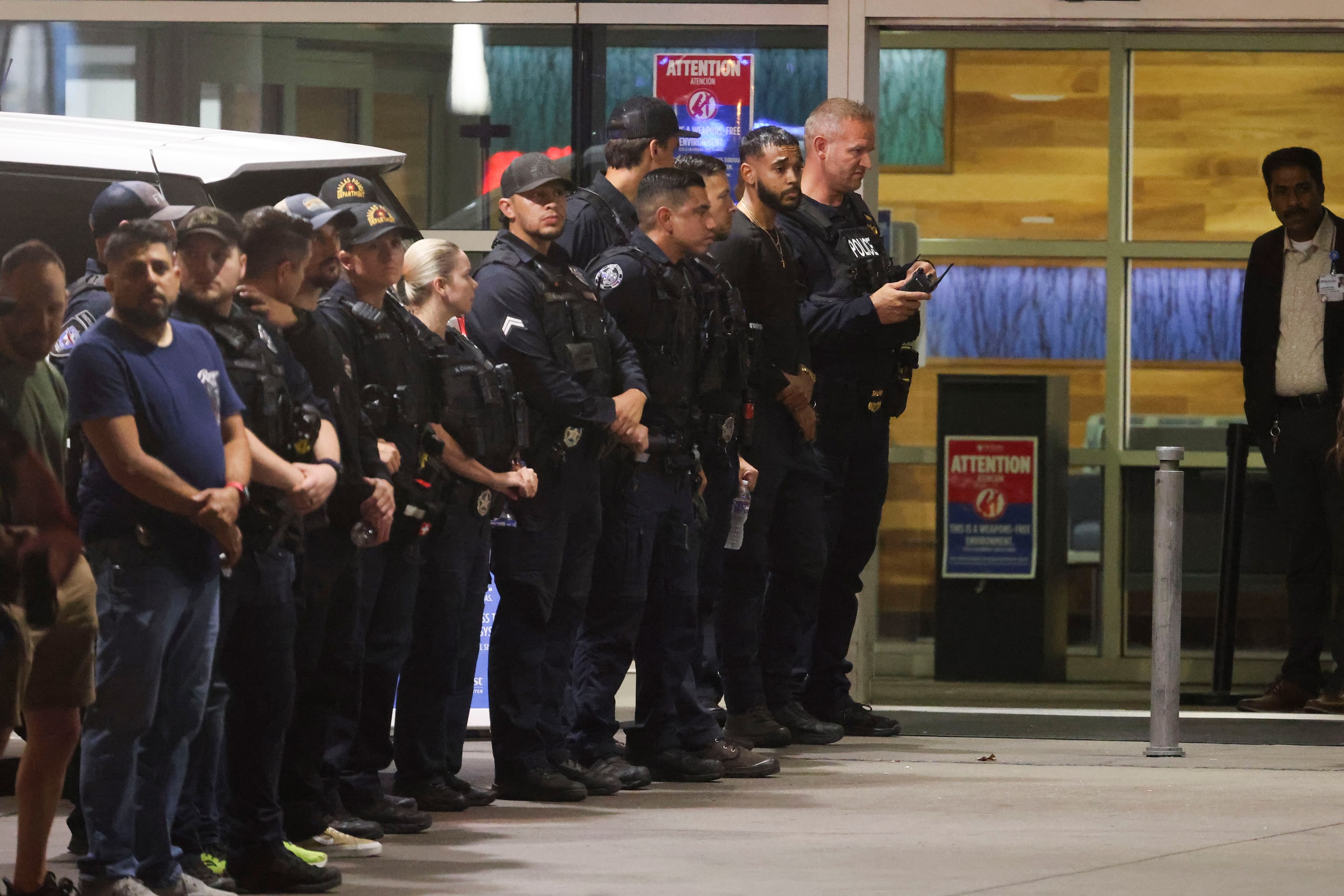 Dallas Police Department officers line up for a procession, on Friday, Aug. 30, 2024, at...