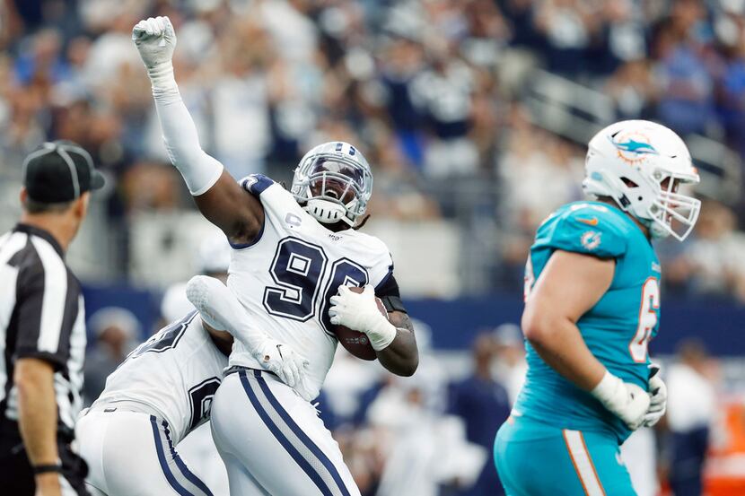 Dallas Cowboys defensive end Demarcus Lawrence (90) celebrates with Dallas Cowboys defensive...