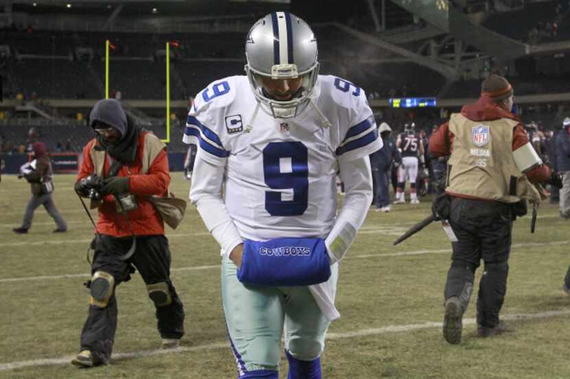 Dallas Cowboys quarterback Tony Romo (9) walks off the field after a loss against the...