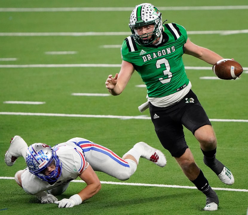 Southlake Carroll quarterback Quinn Ewers (3) gets past Austin Westlake linebacker Nicholas...