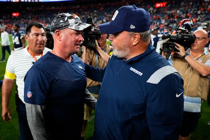 Dallas Cowboys head coach Mike McCarthy, right, and then-head coach of the Denver Broncos...