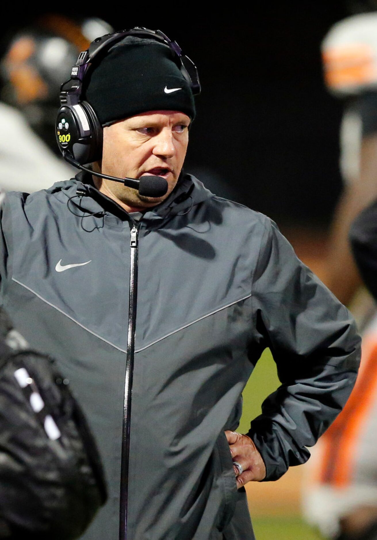 The Colony head coach Rudy Rangel talks to his coaches over the headset during their Class...