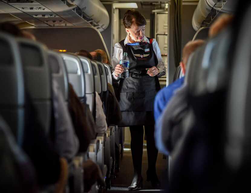 Bette Nash, checking on her American Airlines passengers, still brings the people on her...