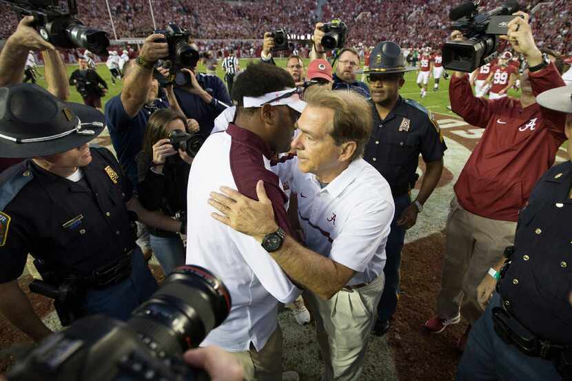 Alabama head coach Nick Saban hugs Texas A&M head coach Kevin Sumlin after 33-14 Alabama...