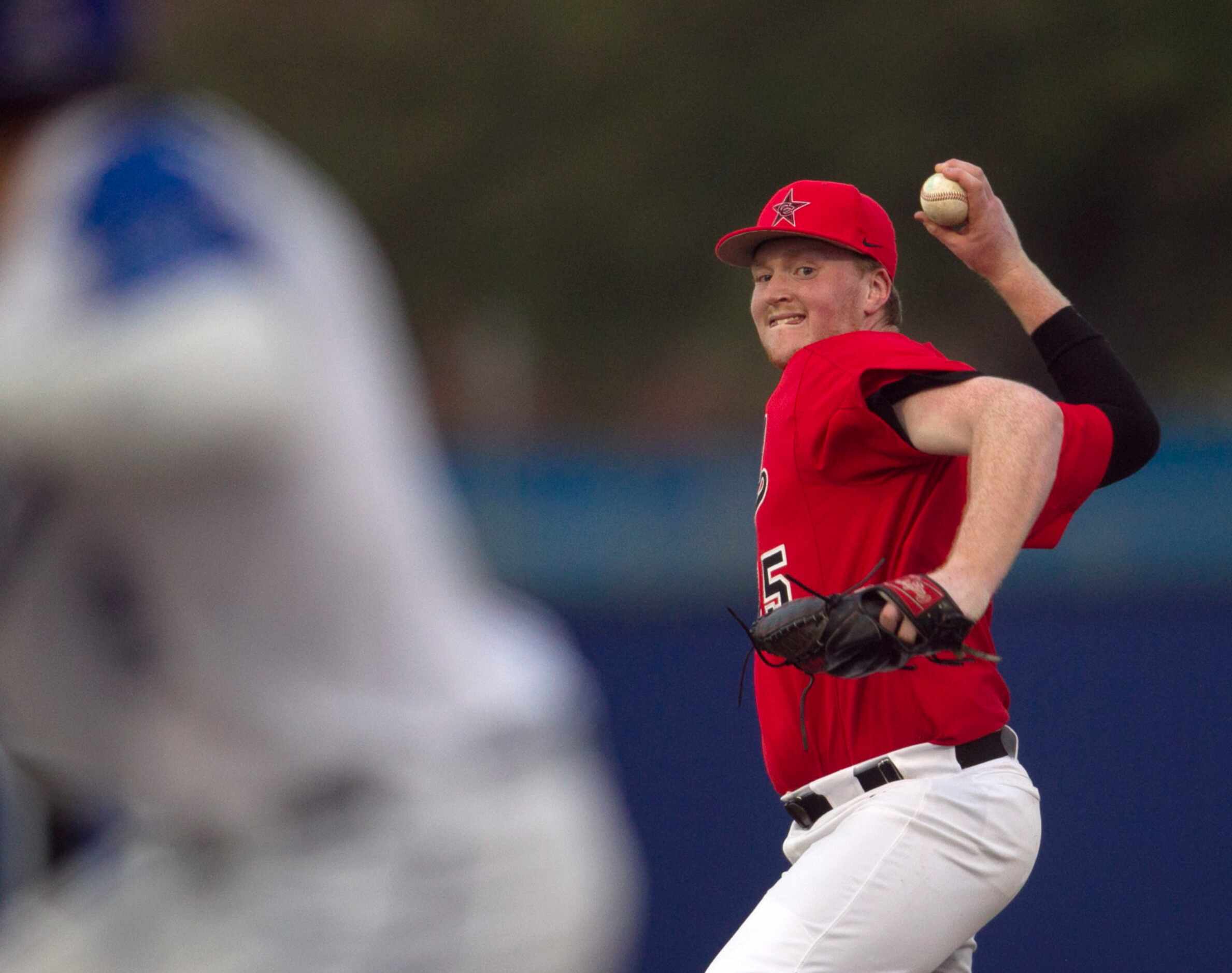 Coppell pitcher Chayton Krauss (25) prepares to deliver a pitch to a Hebron batter during...