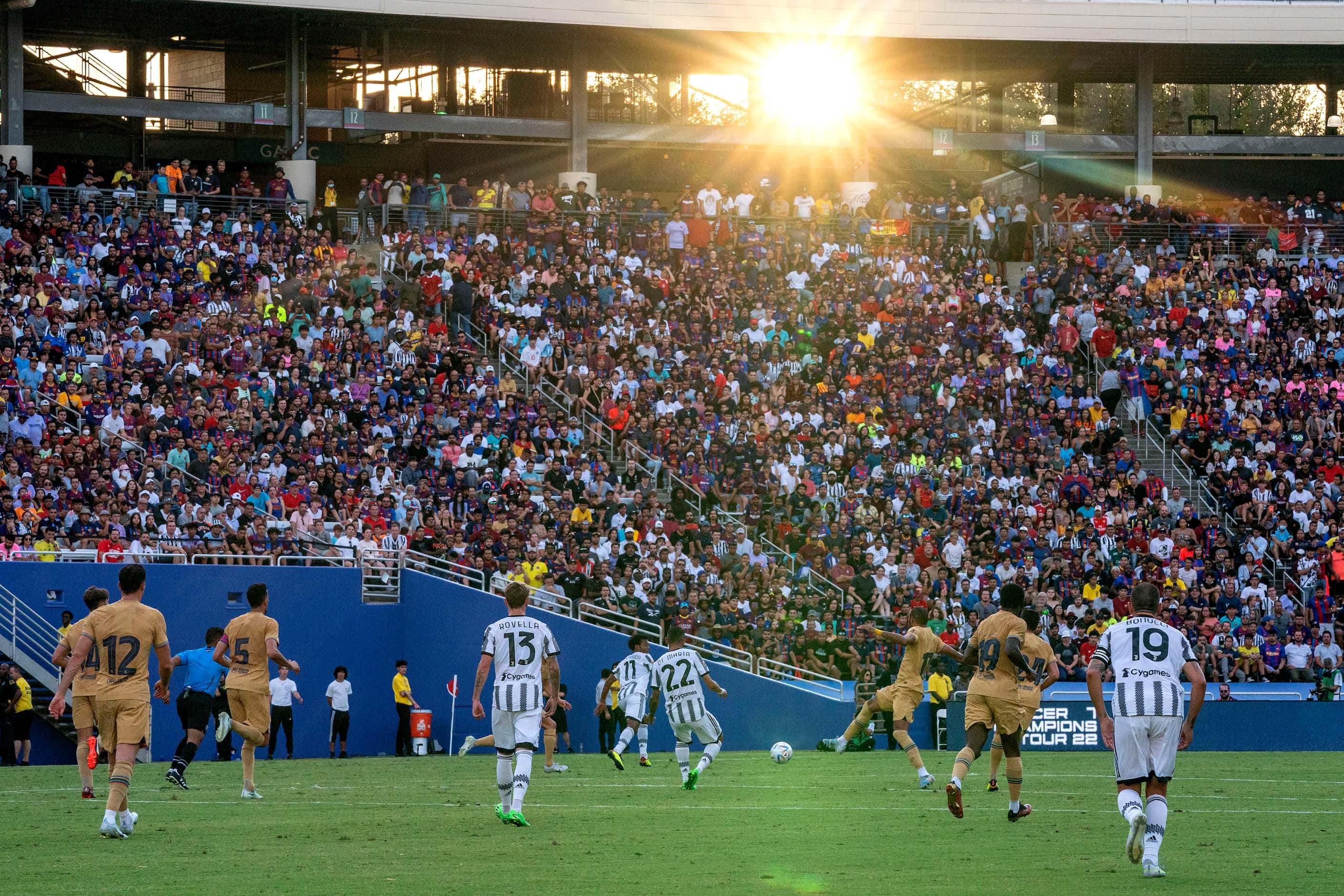 Sunlight pours into the Cotton Bowl during the first half of a soccer match between...