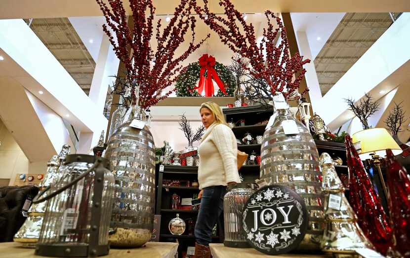 Shopper Gretchen Wickes, of Plano, shops in the holiday decor merchandise area at Nebraska...