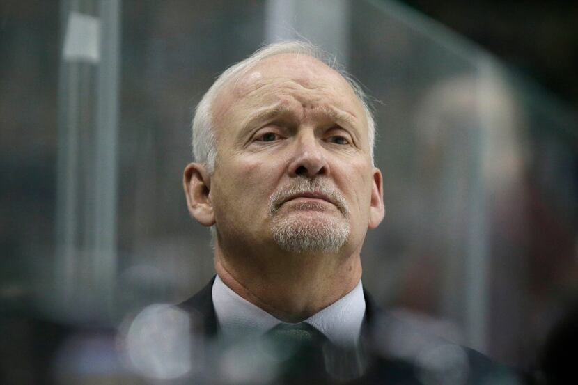 Dallas Stars head coach Lindy Ruff watches from the bench during the first period of an NHL...