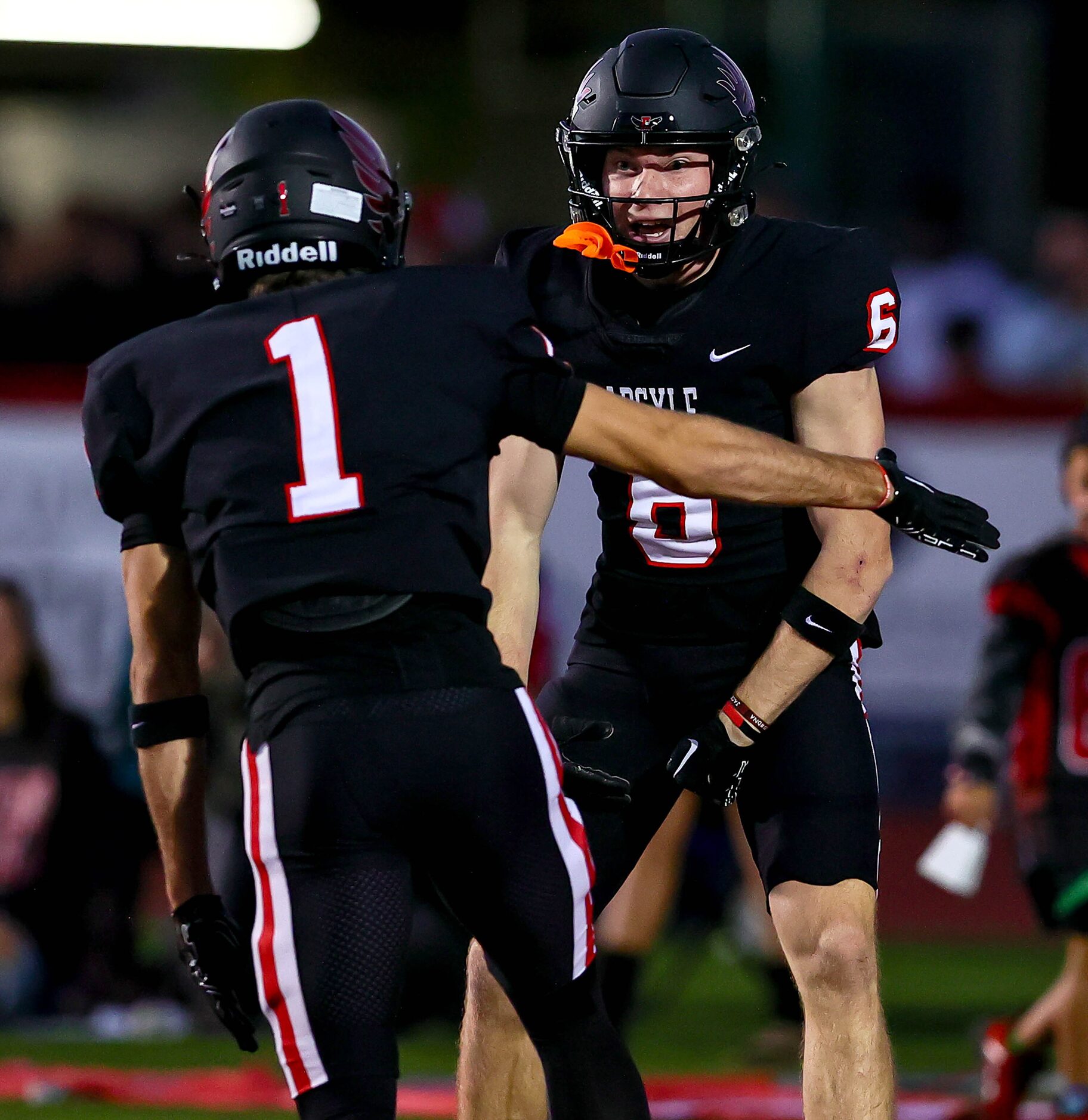 Argyle wide receiver Lane Stewart (6) celebrates with wide receiver Will Krzysiak (1) after...