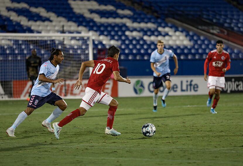 Arturo Rodrigez (#10) cuts inside against Forward Madison in the North Texas SC playoff...