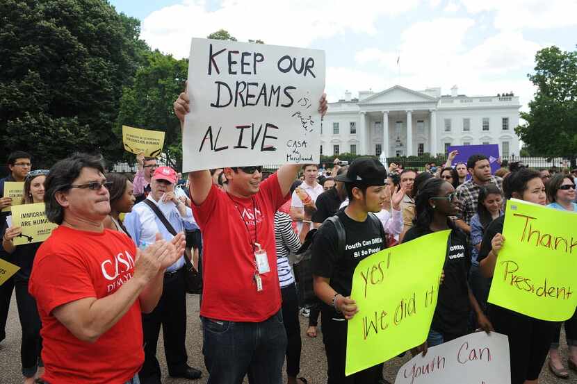 At the White House on June 15, 2012, demonstrators celebrate President Barack Obama's...
