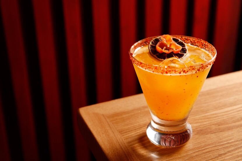 The sicar, meaning "smoky leaves" in Mayan, made with Banhez mescal, papaya puree,...