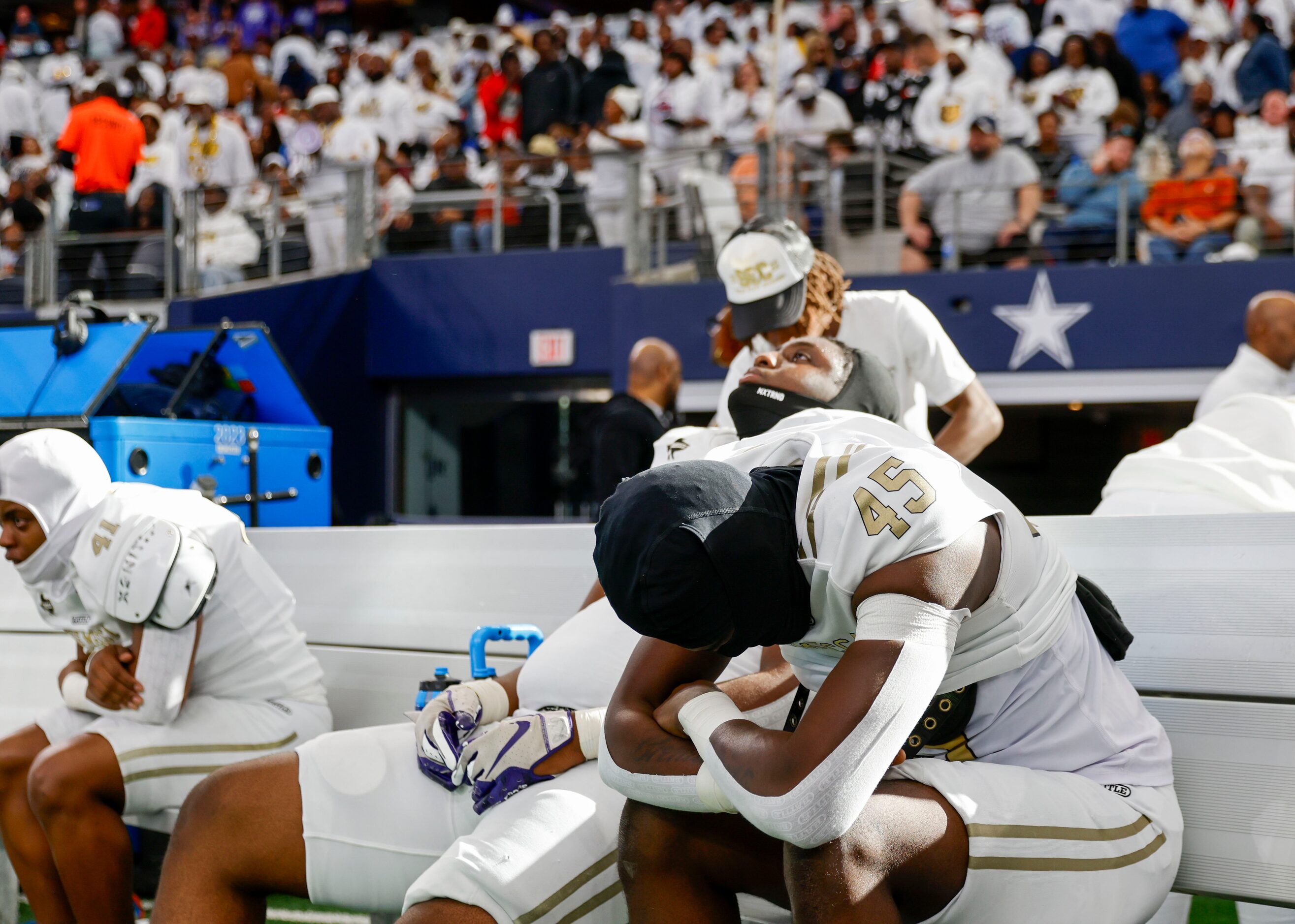 South Oak Cliff’s Defensive line Kelan Durant (45) alongside his teammates becomes emotional...